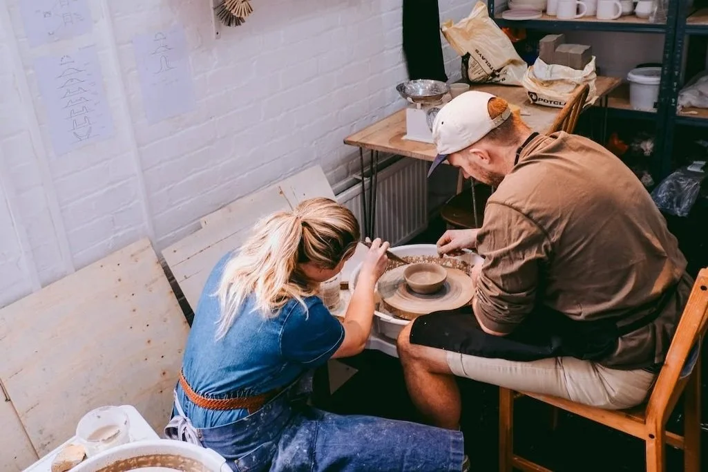 Private one on one pottery class with a man and emma at the pottery wheel