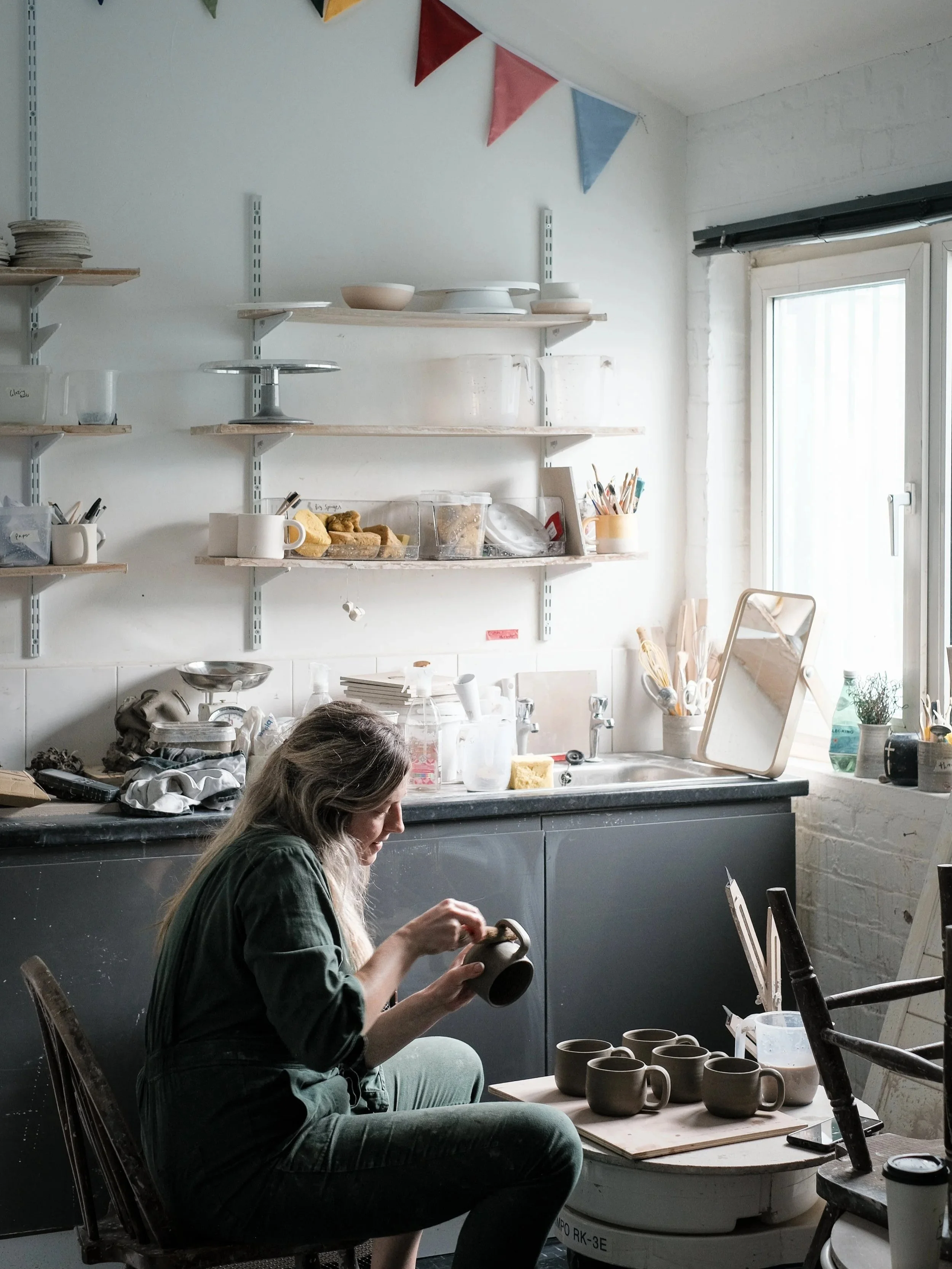 Emma, working at the potters wheel in her studio in Macclesfield