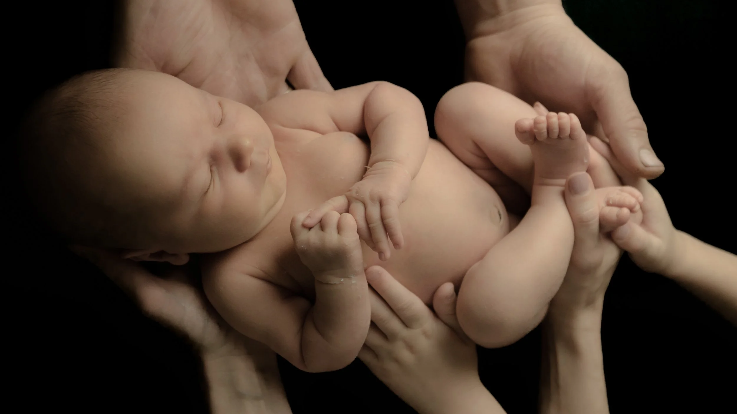 newborn baby photoshoot, black background color theme, Hampshire and West Sussex, Southampton