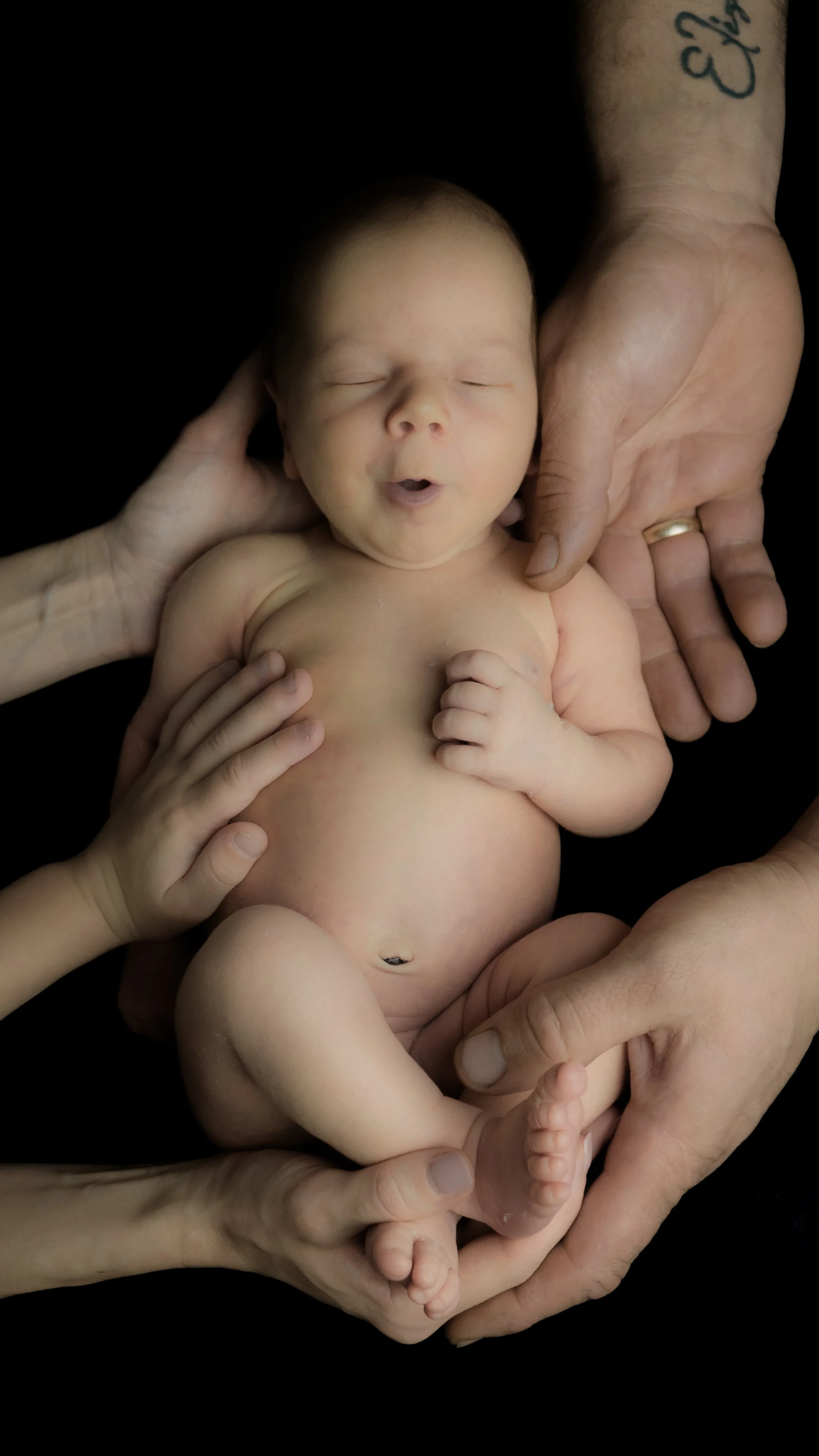 newborn baby photoshoot, black background color theme, Hampshire and West Sussex, Southampton