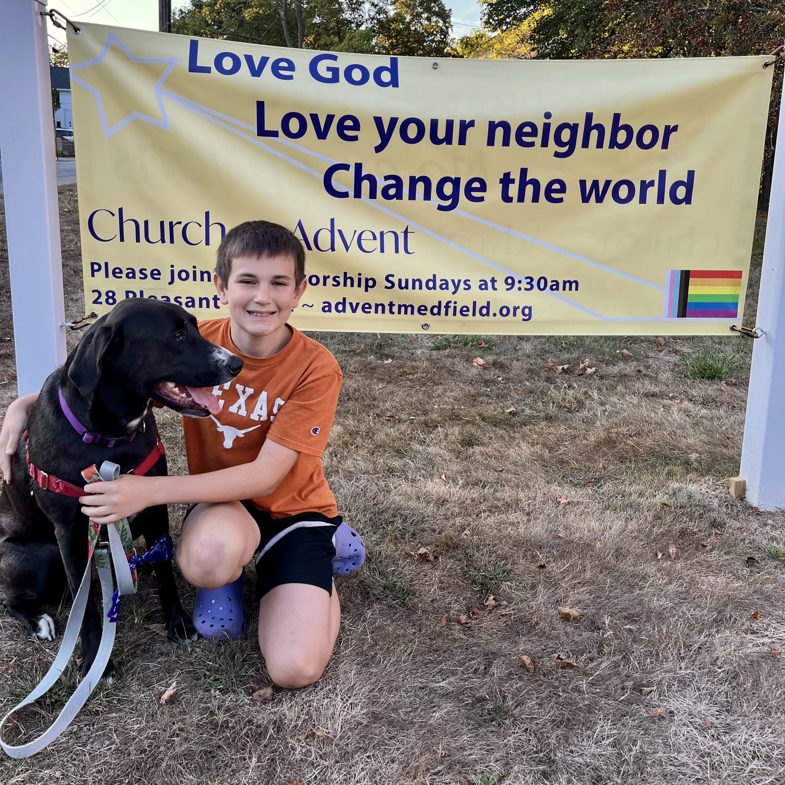 kid and dog and banner.jpeg