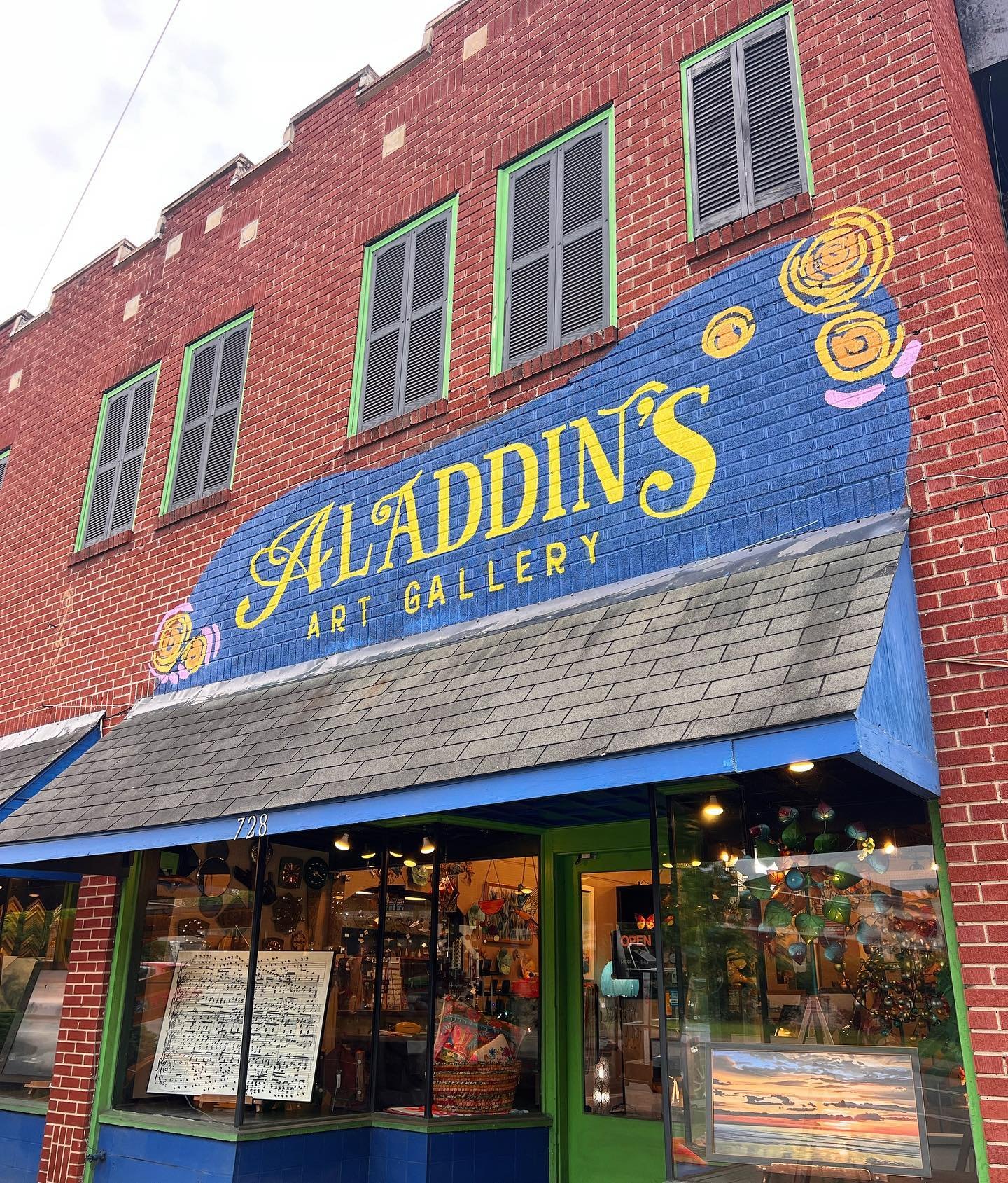 I saw the siiign 🎶 Just completed this new sign at Aladdin&rsquo;s Art Gallery, our first client to go through all 3 services of custom murals, brand design and sign painting!

The owner, Mary, loved what we did with her business name in our custom 