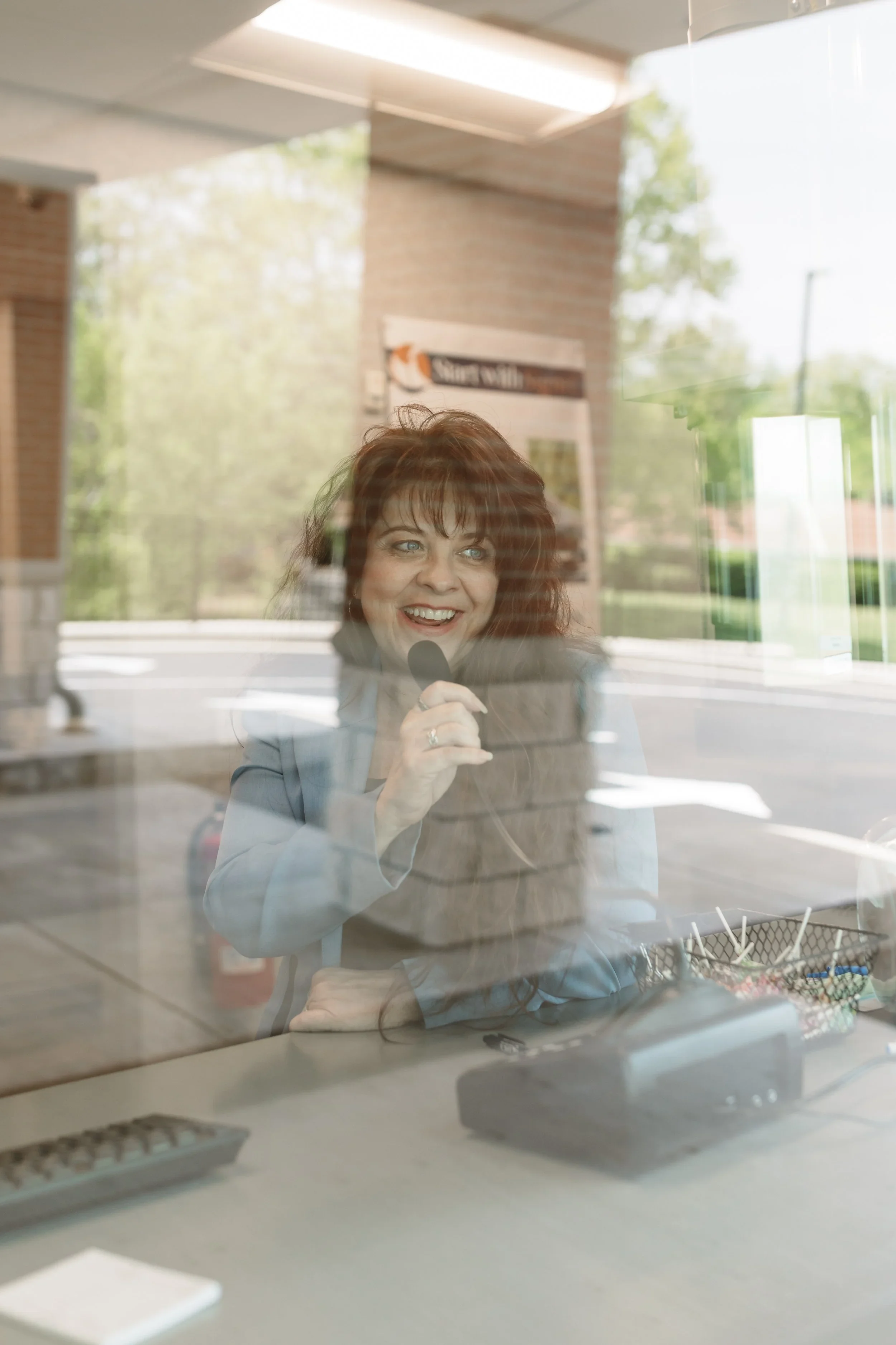 Happy Teller in Window