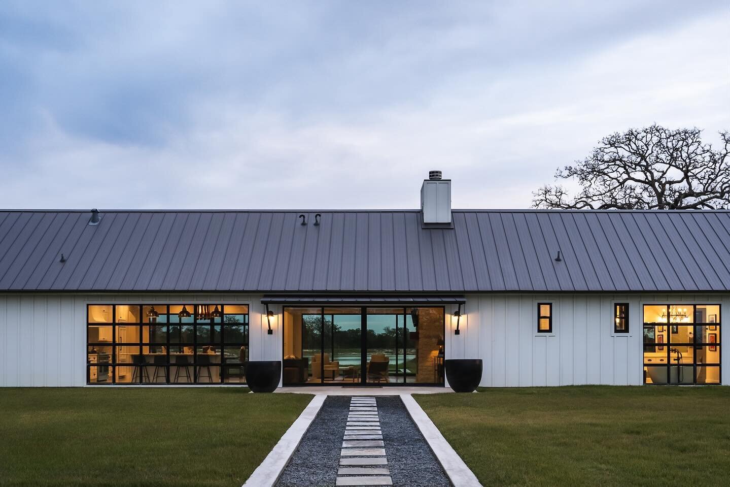 A wintery and moody twilight gave way to a spectacular though very brief sunset 🌅 (see last slide)

Modern farmhouse in Round Top by @jbryantboyddesignbuild with its own large pond/lake&hellip; when does a pond become a lake?