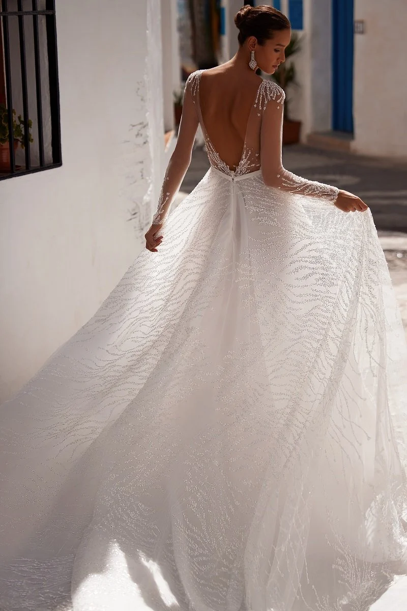 Julie Vino from Isreal wedding dress fitted long sleeves elegant wedding dress edgy wedding dress bell sleeves artisan Omaha wedding dress boutique