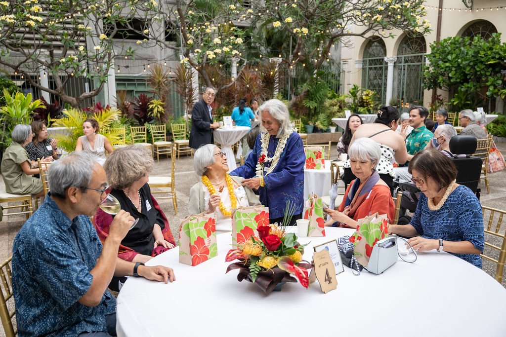 144. Esther Arinaga and table.jpg