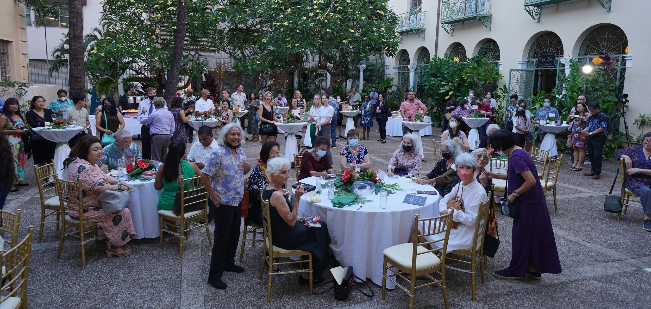 Festive crowd at Cafe Julia courtyard 6.1.22 w Amy A..JPG