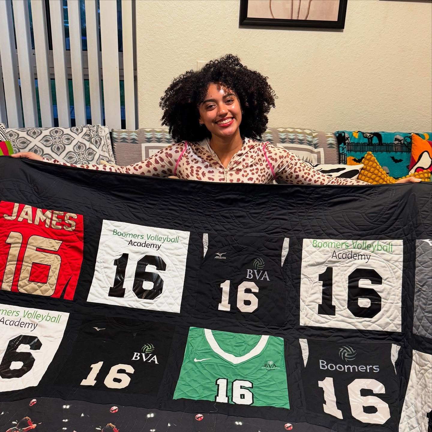 This quilt is a combination of all of Coco&rsquo;s volleyball jerseys from all of her seasons as a national player. Loose Ends finisher, Merrie, spent about 25 hours on this, then brought it to a longarmer who used a volleyball pattern to quilt it.

