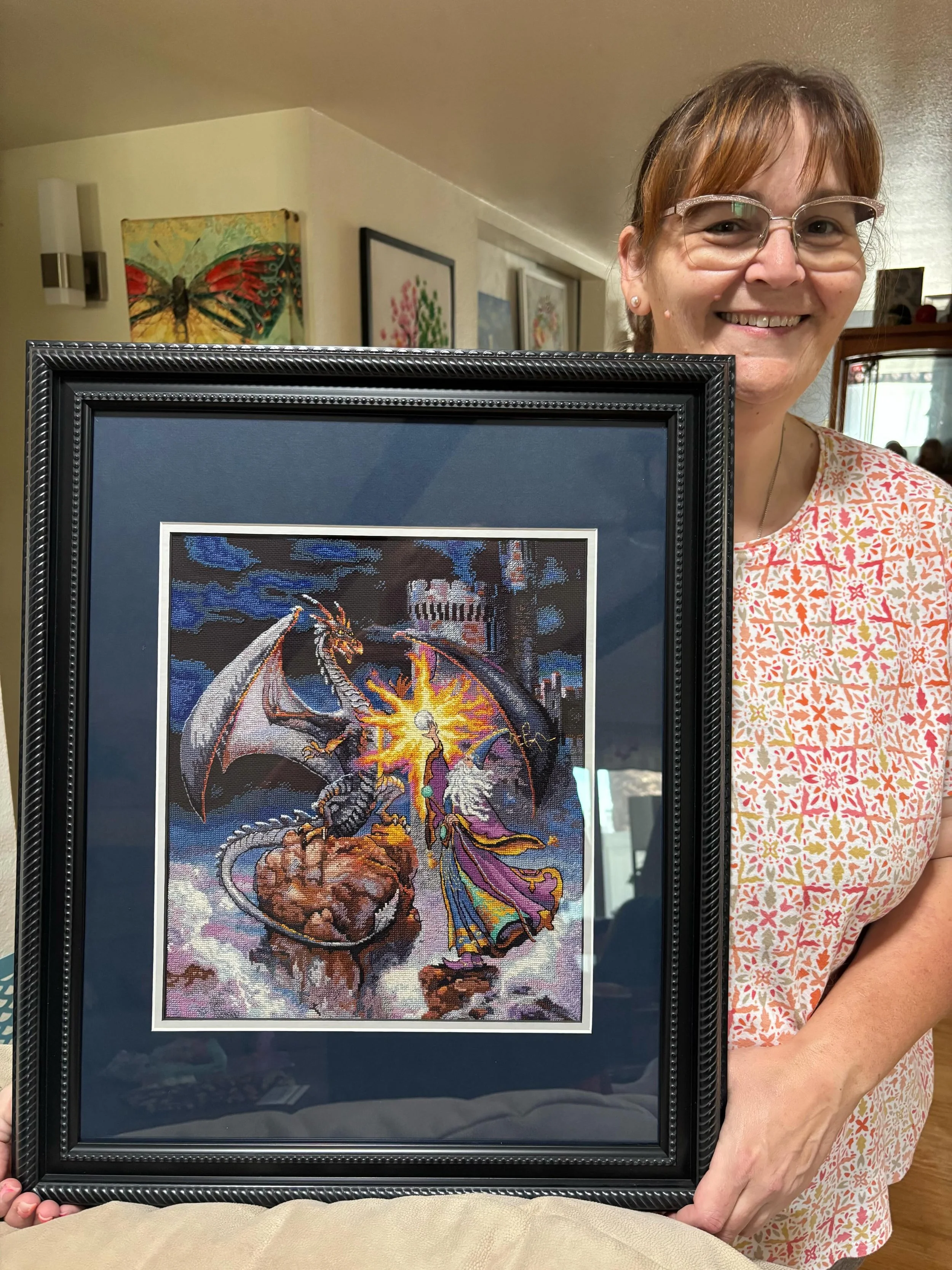 Sharon started this cross stitch for her grandson before losing her sight. It will be gifted to him next month for his birthday! Finishing work done by Loose Ends finisher, Lee. #dragon
