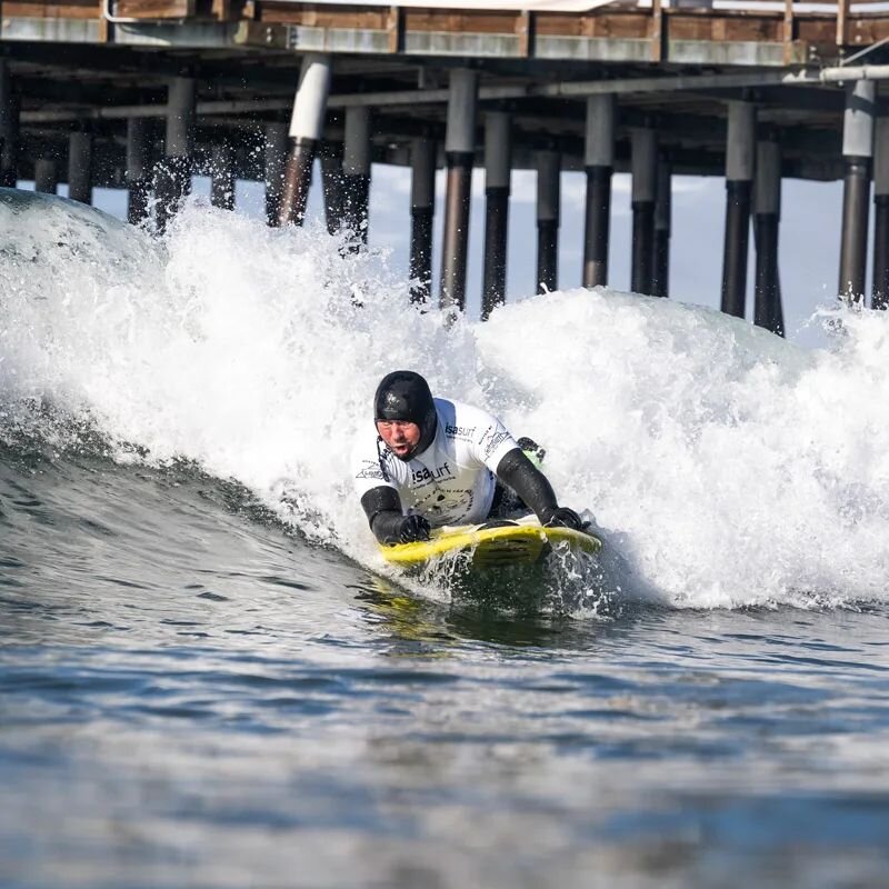 It's cold in Pismo!! 
We are gearing up for our upcoming fundraisers to help get our crew to the @isasurfing World Parasurf Championships this December! Reach out if you want to help support! 
(ID: @ericlazar3 surfing a wave prone. He is wearing a ho