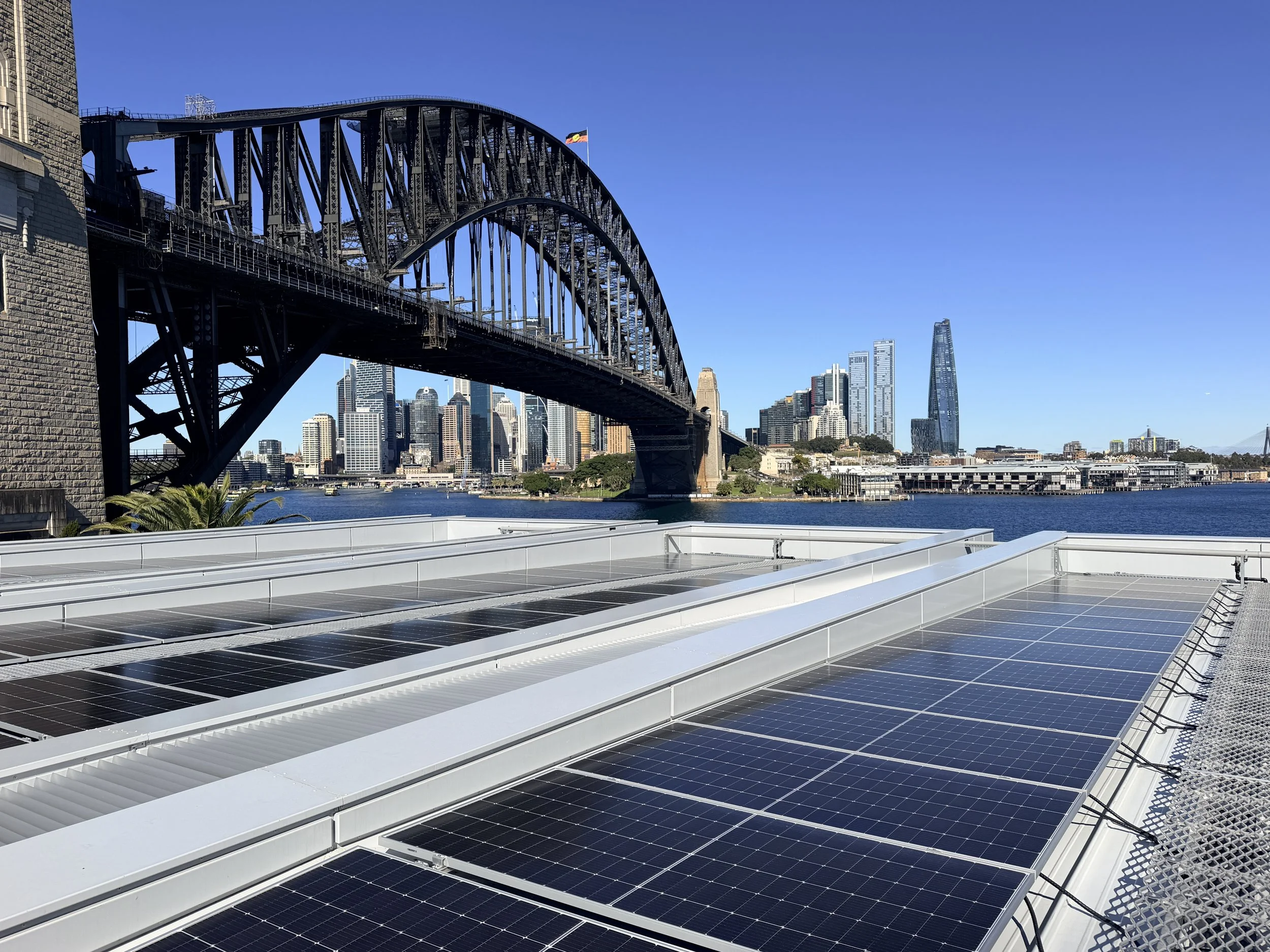Solar installation at North Sydney Olympic Pool overlooking the Sydney Harbour Bridge