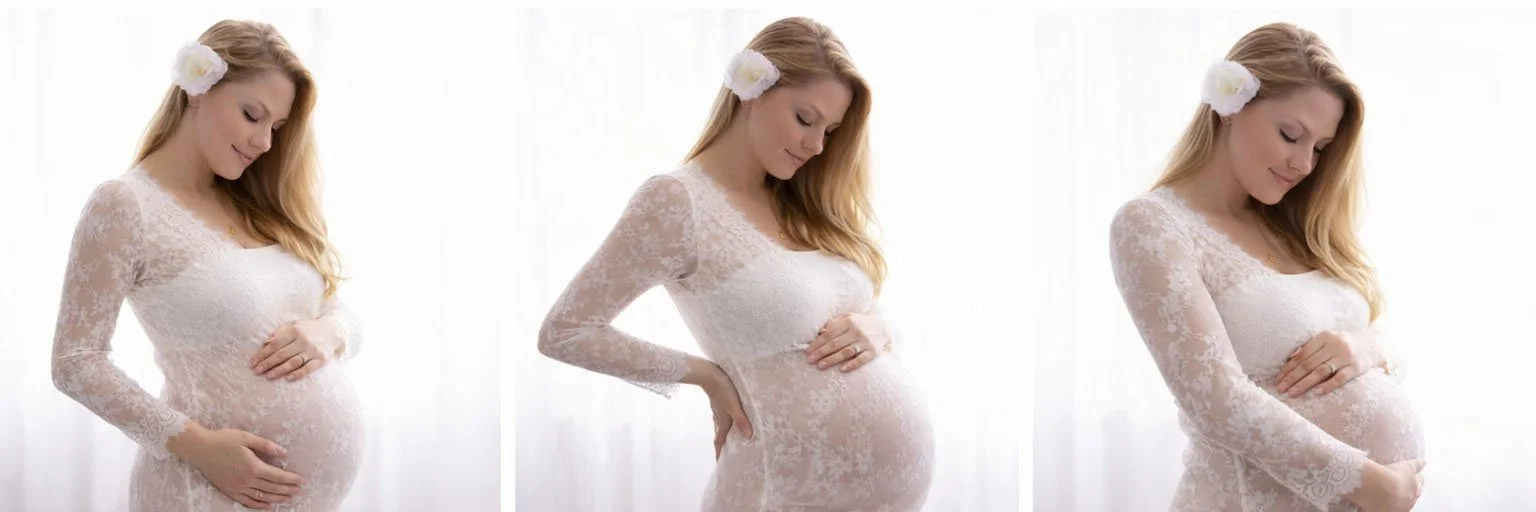 Maternity portrait of a woman wearing white lace and holding her belly, photographed at a Longmont Photography studio serving clients from Denver, Boulder and Northern Colorado.