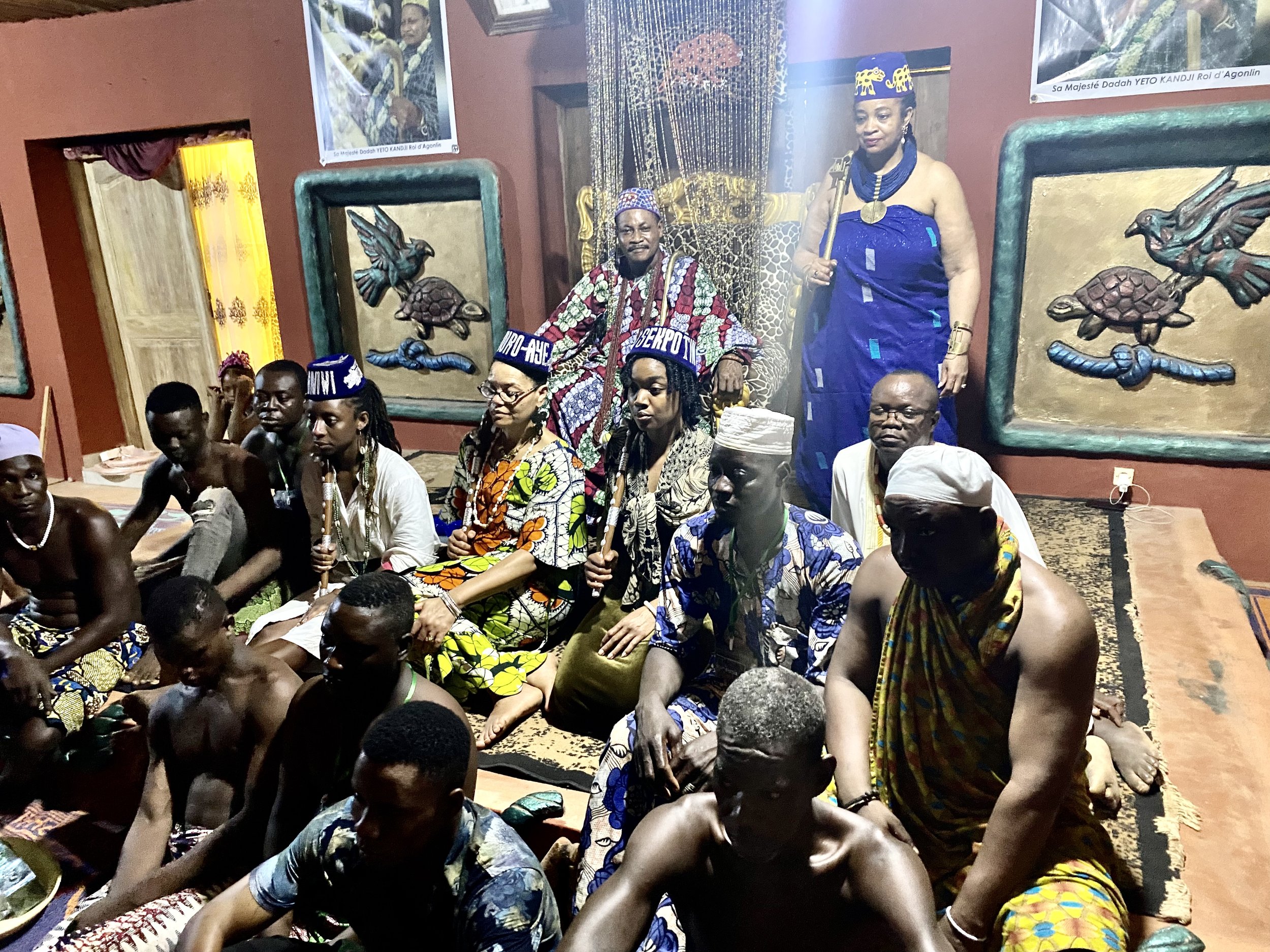 Diviners, priests, and praise singers sit with the newly installed Agoodjié