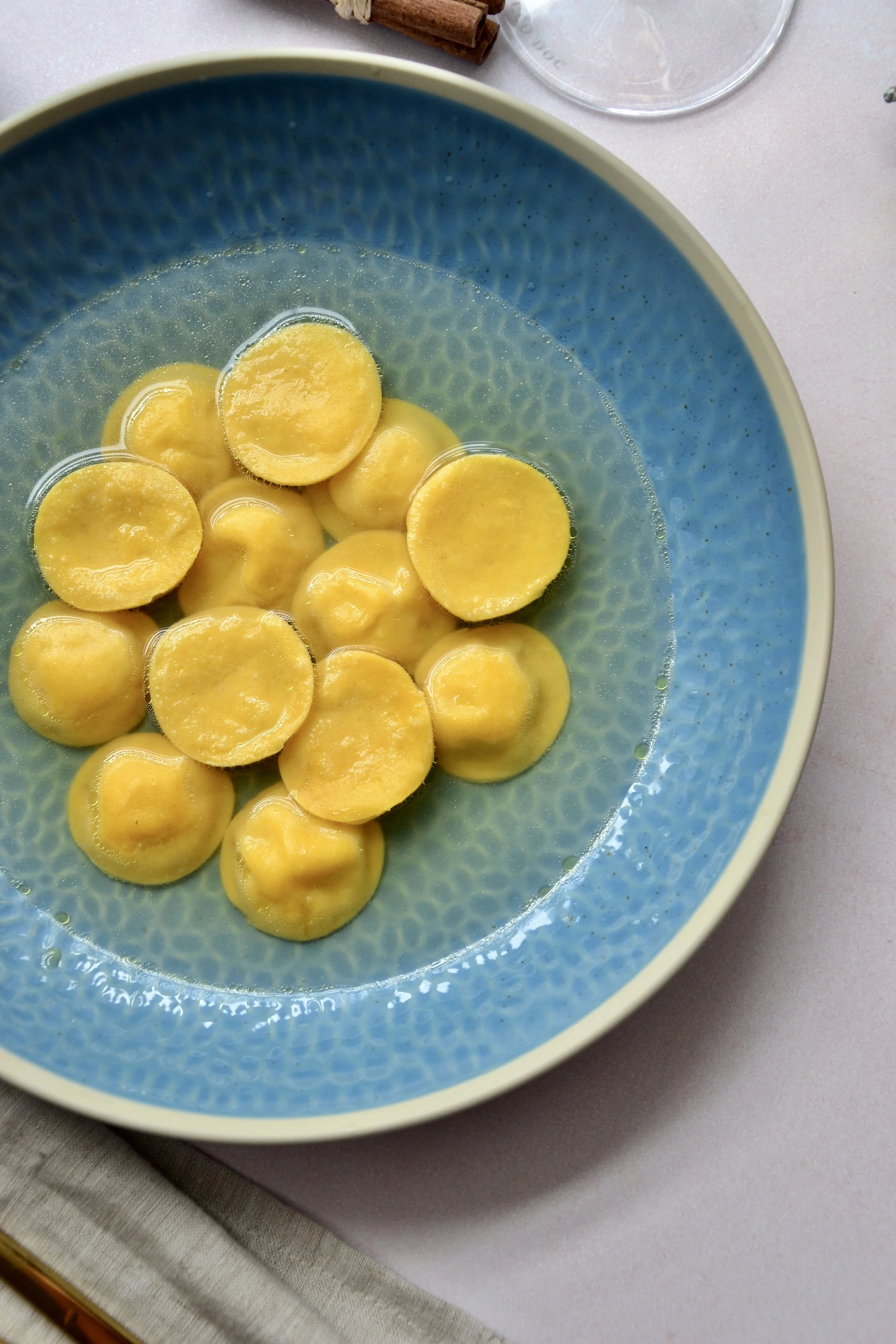 Smoked potatoes and bottarga Anolini in Grana Padano consommé