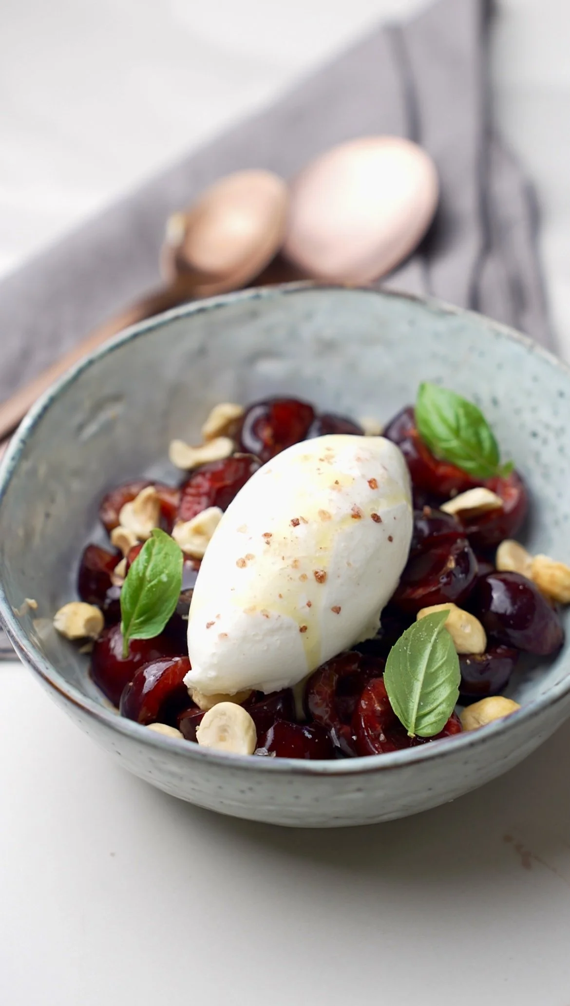 Silky milk ice cream with extra virgin olive oil, cherries, almonds and basil