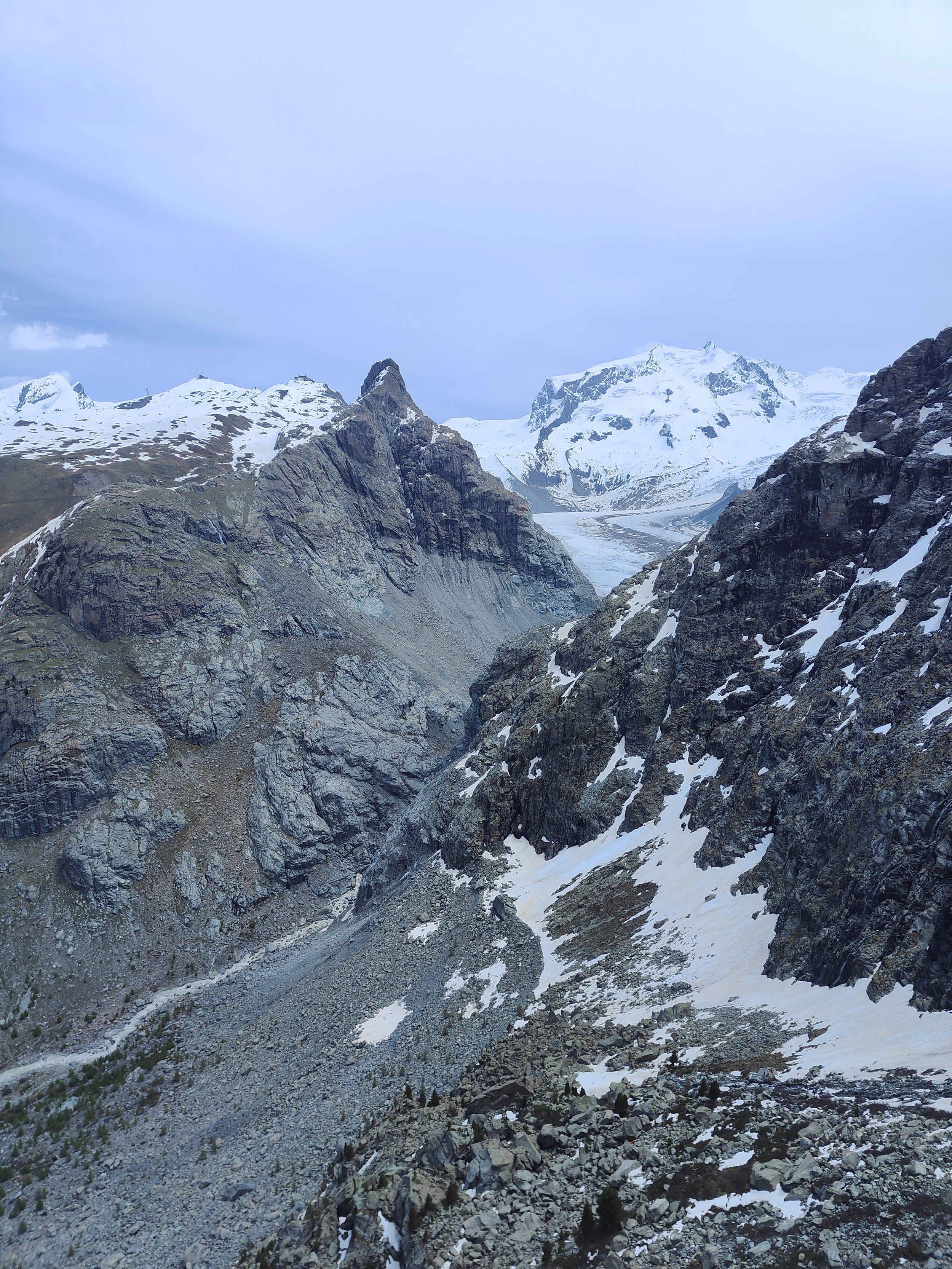 Snow-capped mountains and rocky terrain in a mountainous landscape.