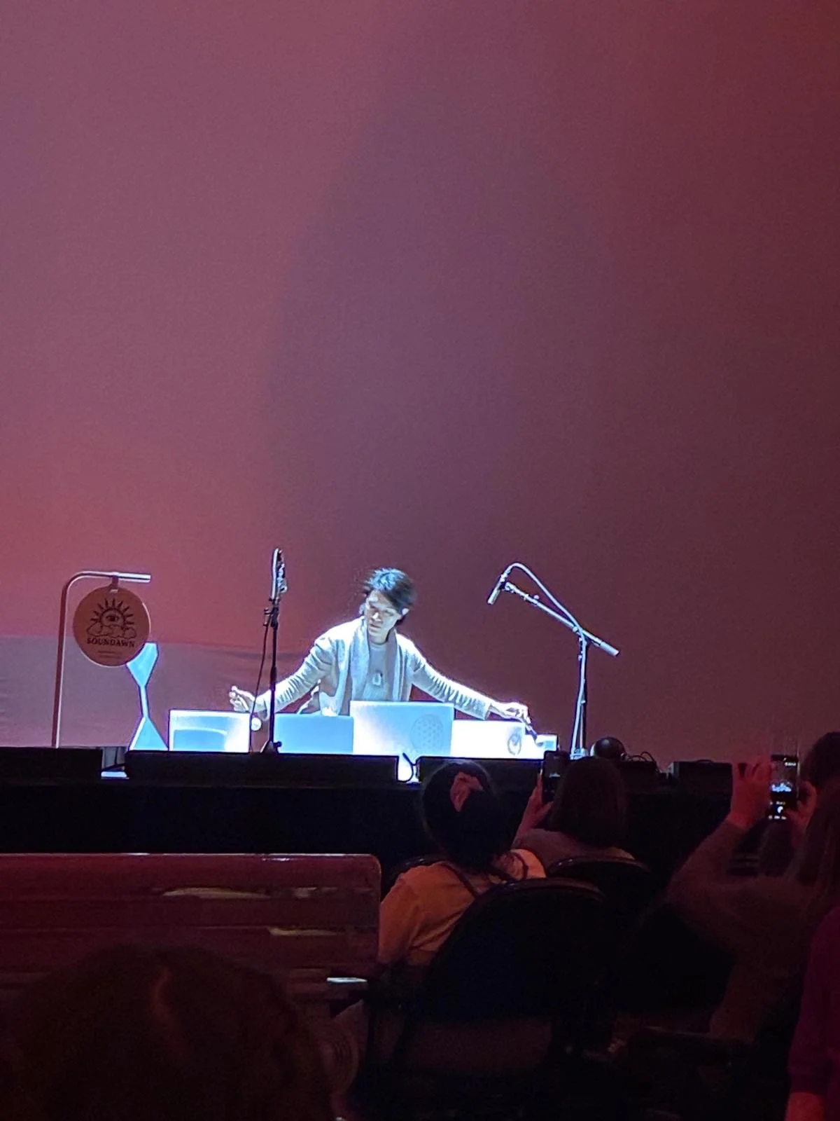 Natalie Chan performing crystal sound bowls at her station on stage at Radio City Music Hall, opening for CA7RIEL & Paco Amoroso — Soundawn.