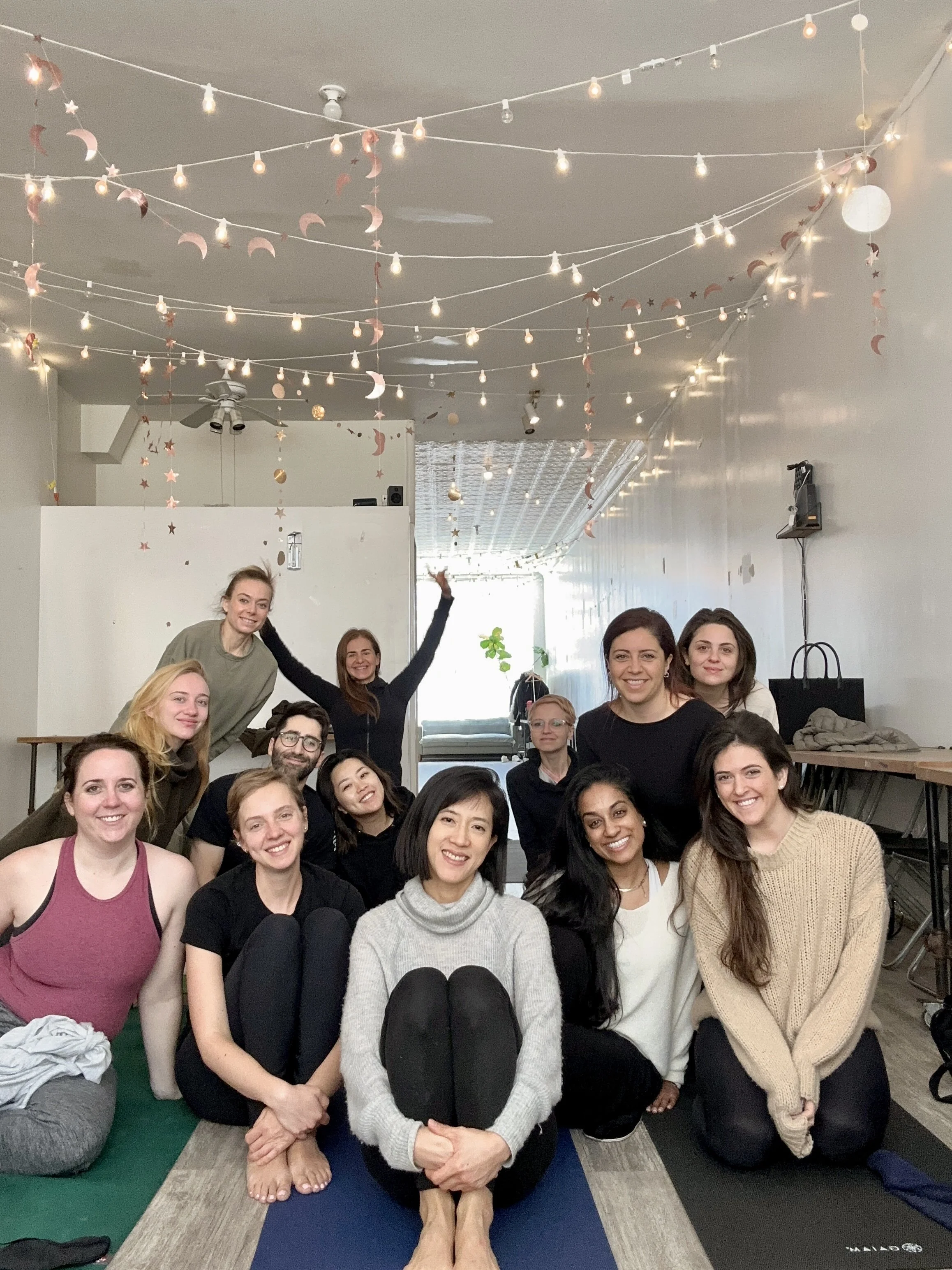 A group photo of participants of a group sound bath at Soundawn Sound Bath Center in Brooklyn, NYC
