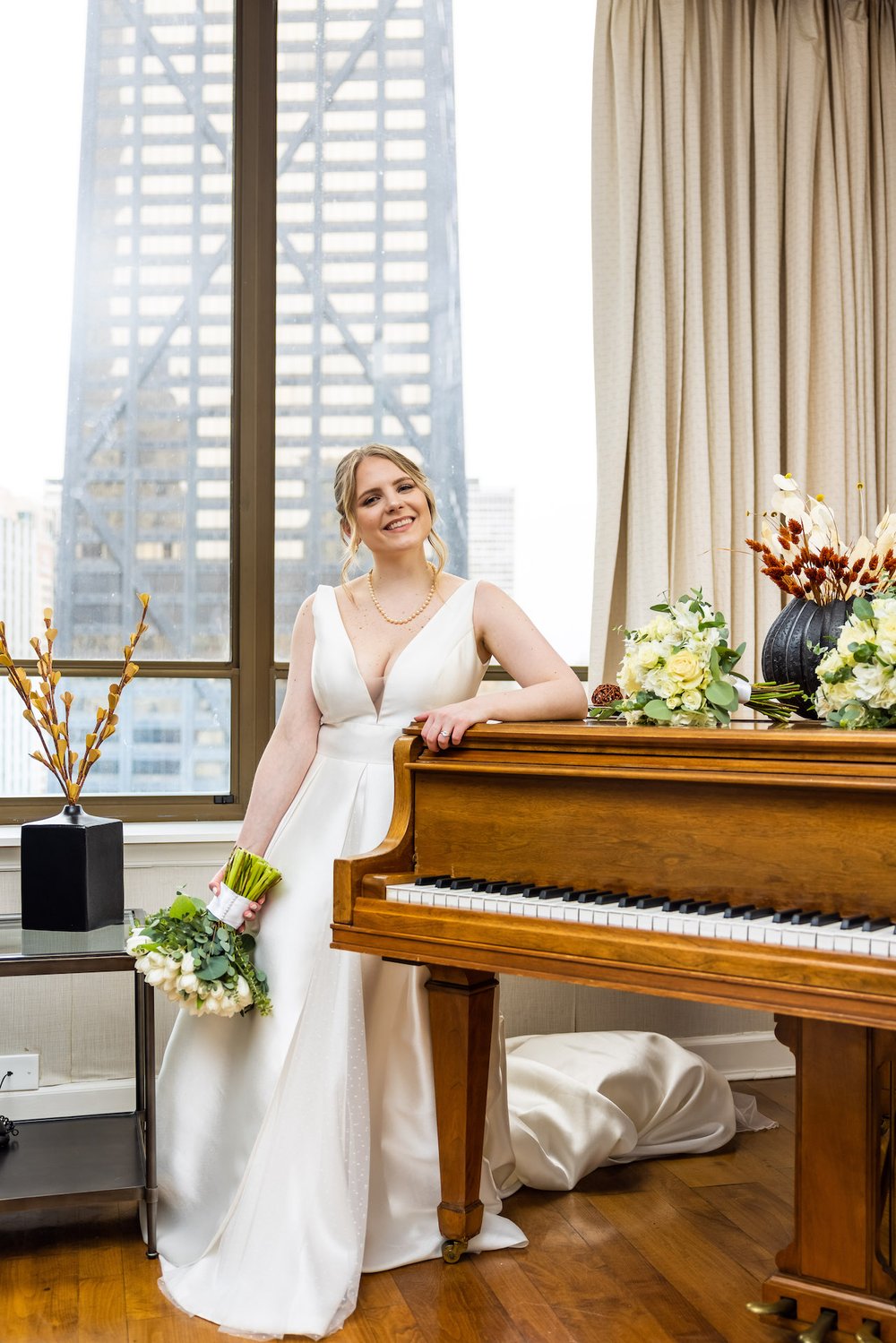  Alex Maldonado Photography | Chicago Wedding and lifestyle Photographer |  selina hotel bridal portrait with skyline view out window hancock building 