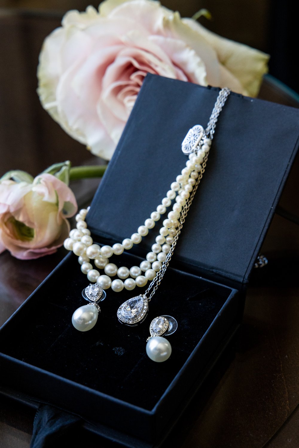 Alex Maldonado Photography | Chicago Wedding Photographer | -details of jewlery ear rings and necklace with flowers.jpg