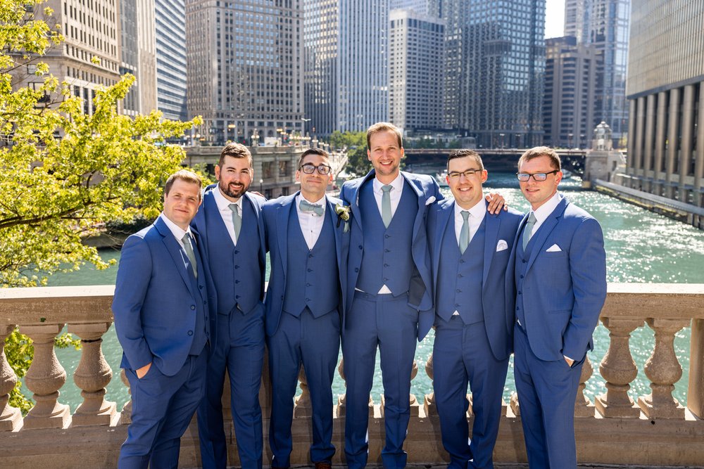 Alex Maldonado Photography | Chicago Wedding Photographer | groomsman and groom photos at wrigley building chicago river.jpg