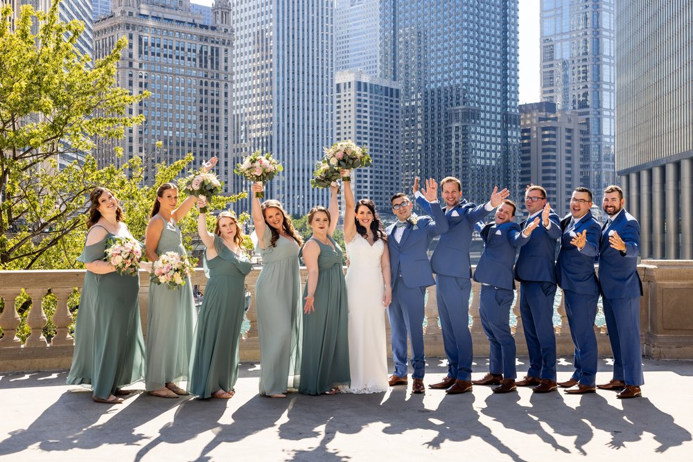 Alex Maldonado Photography | Chicago Wedding Photographer | wedding party photos at wrigley building fun cheer.jpg