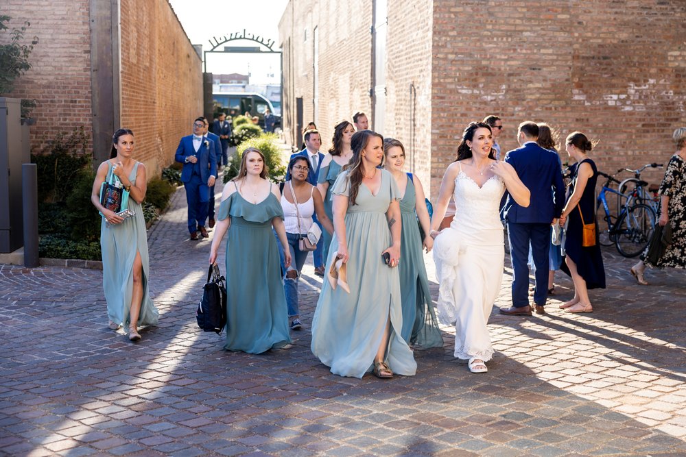 Alex Maldonado Photography | Chicago Wedding Photographer | wedding party walking to venue rockwell on the river.jpg