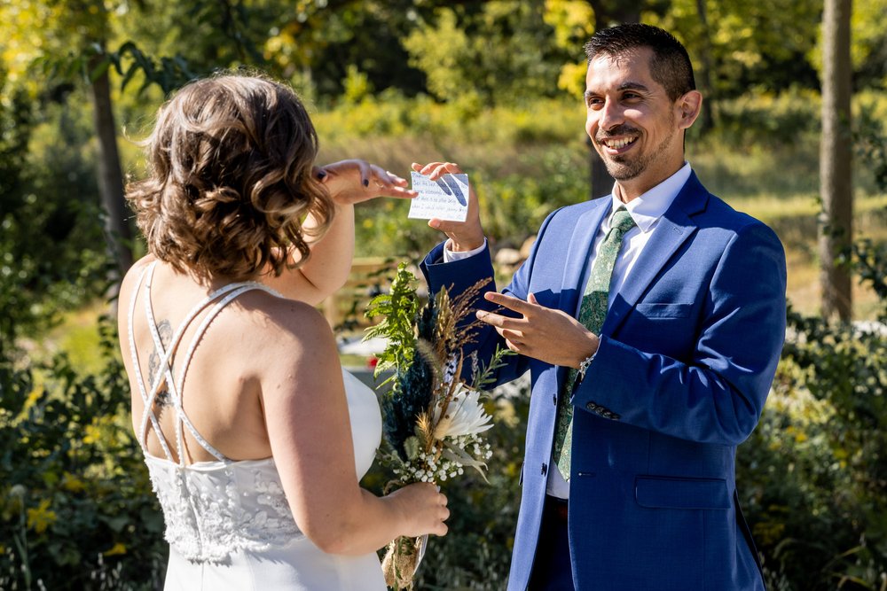 Alex Maldonado Photography | Chicago Wedding Photographer | wedding vows private reading groom at  Four Rivers Environmental Education Center.jpg
