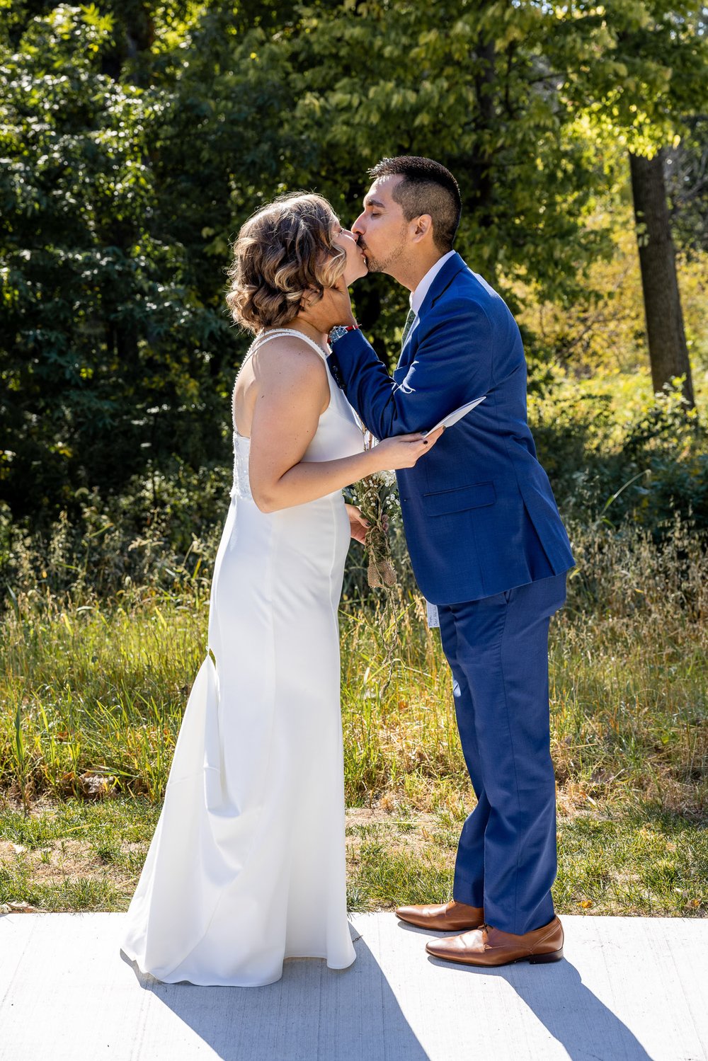 Alex Maldonado Photography | Chicago Wedding Photographer | couple kissing zfter first look at vow readings at  Four Rivers Environmental Education Center.jpg