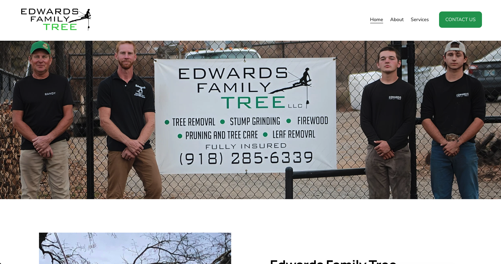 Four men standing in front of a fenced area holding a sign for Edwards Family Tree LLC, which offers tree removal, stump grinding, firewood, pruning, and leaf removal services. The men are wearing black shirts with the company's logo, and one has their hands clasped in front of them.