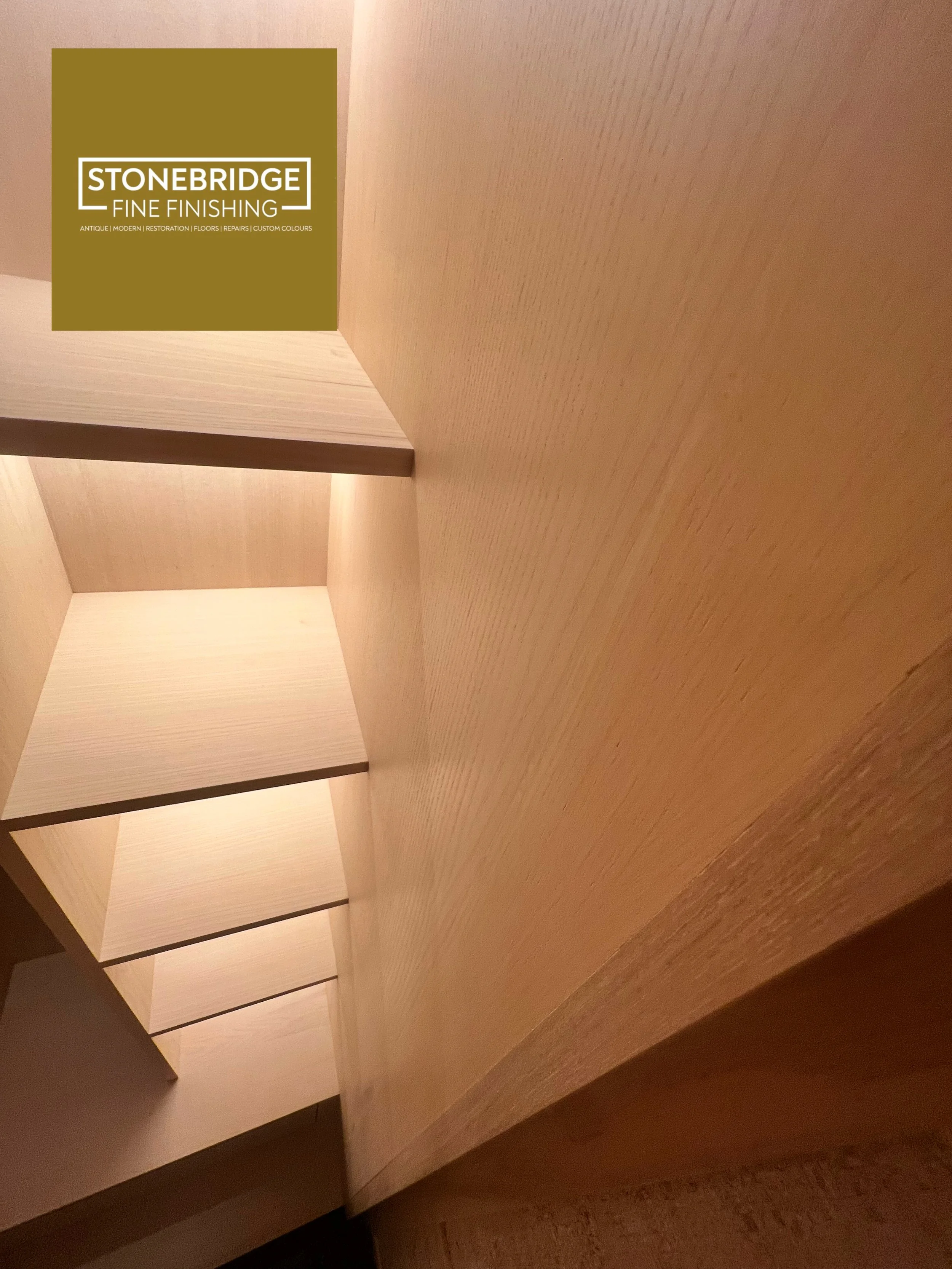 Wooden furniture with compartments in a room with warm lighting.