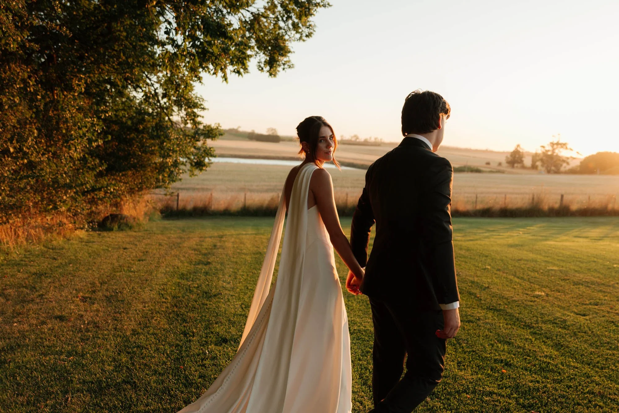 Couple walking into sunset at wedding, Scrub Hill, Daylesford, Victoria Photography