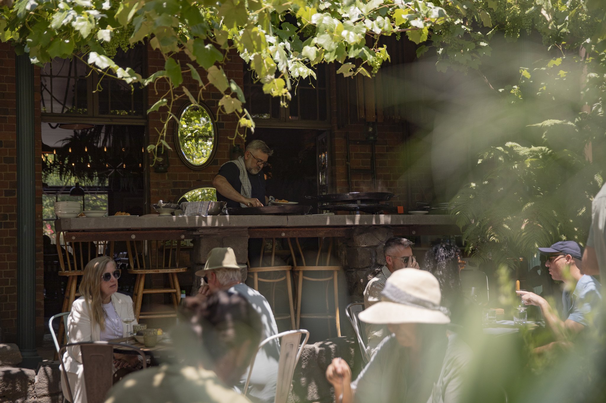 Frank Camorra cooking a Spanish paella lunch in the courtyard of our Kyneton restaurant and wine bar.