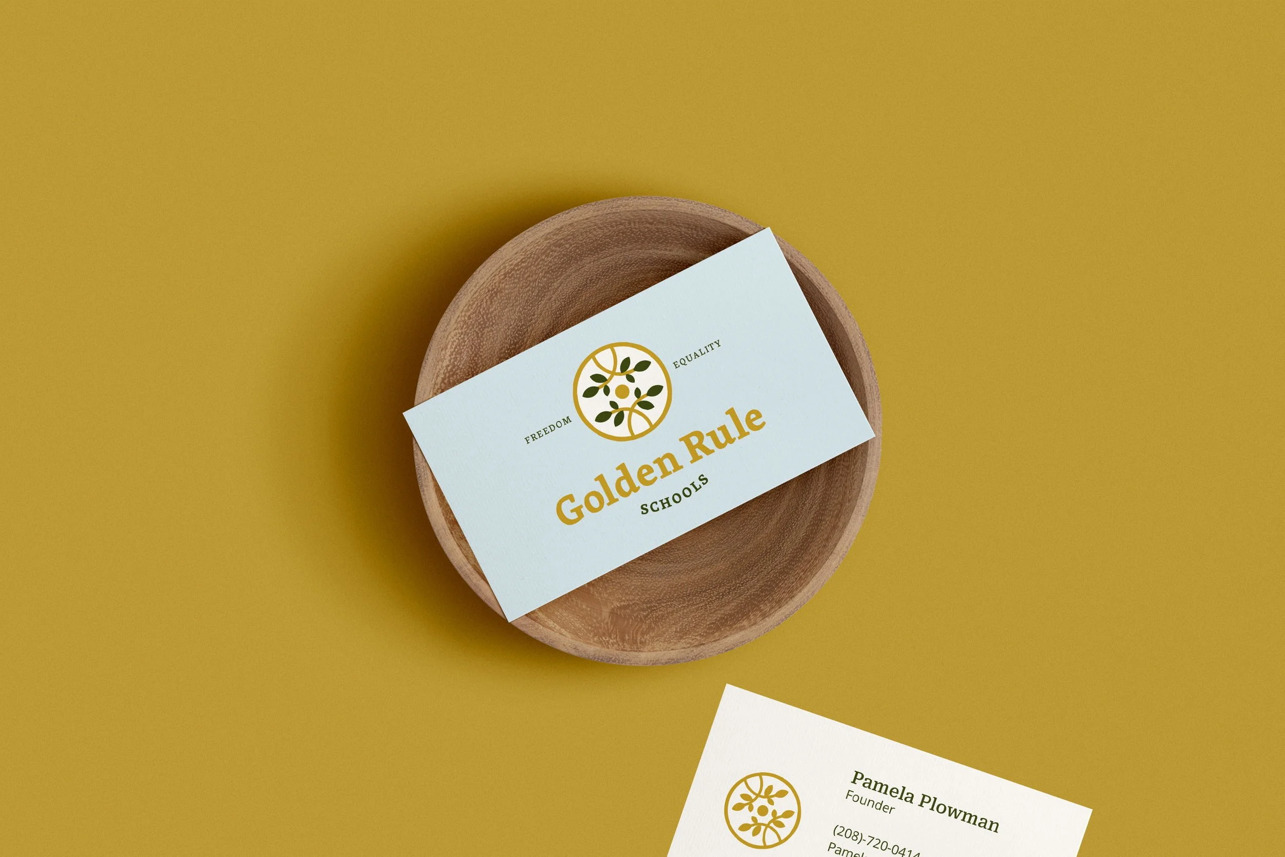 Preschool logo applied to a professional business card as part of a brand identity system