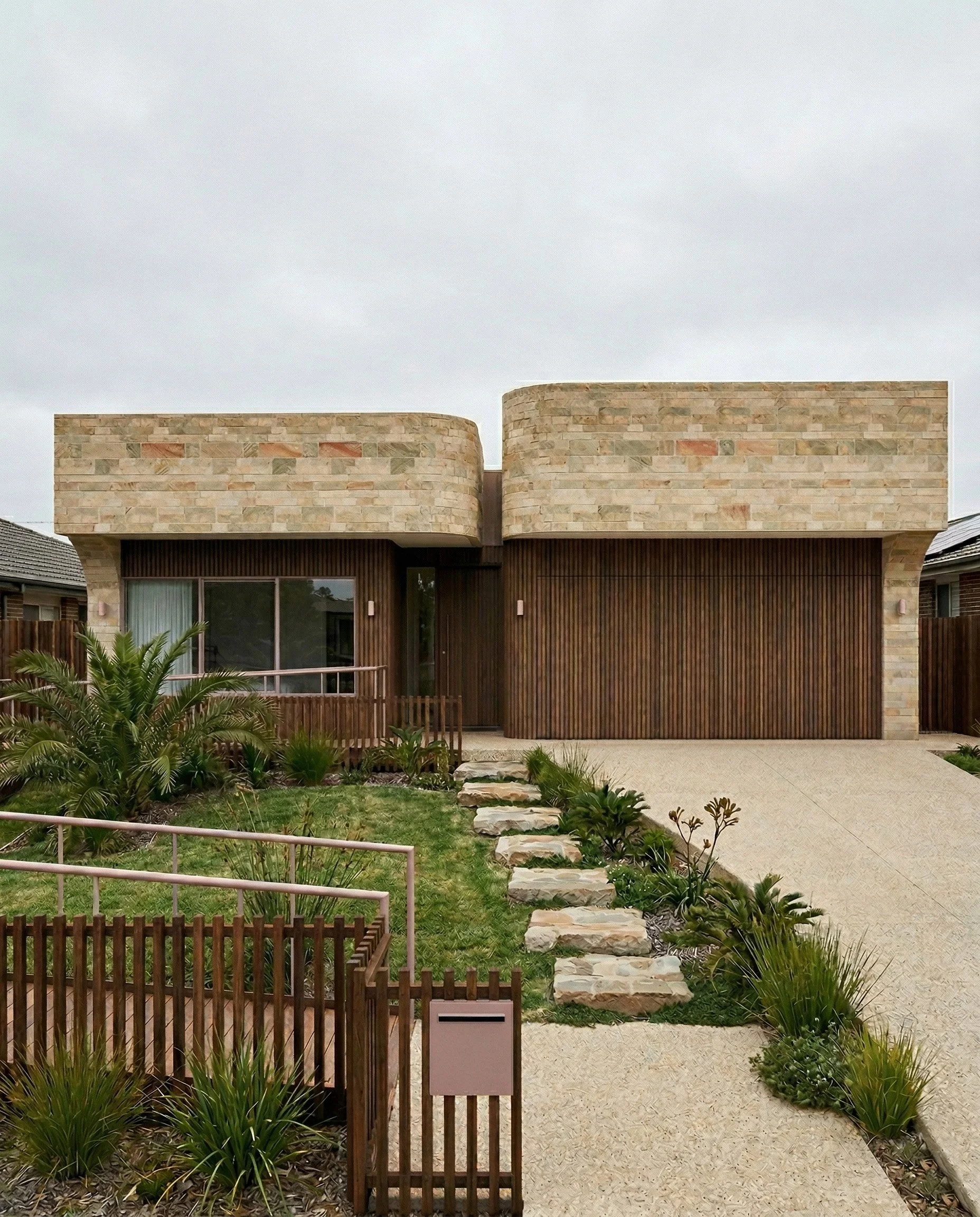 Designed specifically for the High Physical Support category, this residence proves that accessibility does not require compromising on style. The Camberwell home features a tactile limestone brick facade, where sculptural curves create a welcoming a