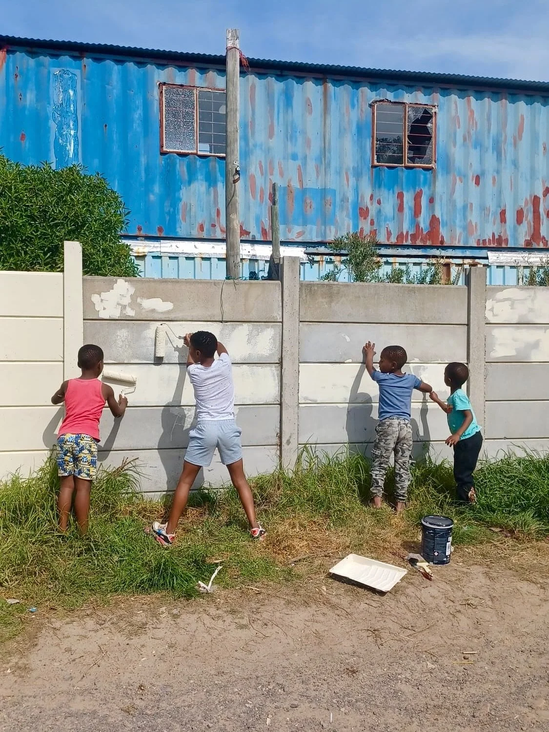 Some little helpers with our wall project.😁 Normally after school, they&rsquo;d play soccer outside the property but they wanted to help paint the wall instead.