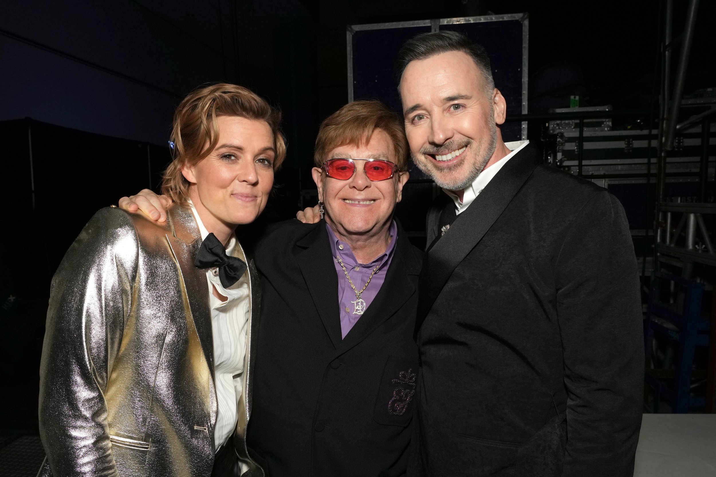  LOS ANGELES, CALIFORNIA - FEBRUARY 03: (L-R) Brandi Carlile, Elton John, and David Furnish attend MusiCares Persons of the Year Honoring Berry Gordy and Smokey Robinson at Los Angeles Convention Center on February 03, 2023 in Los Angeles, California
