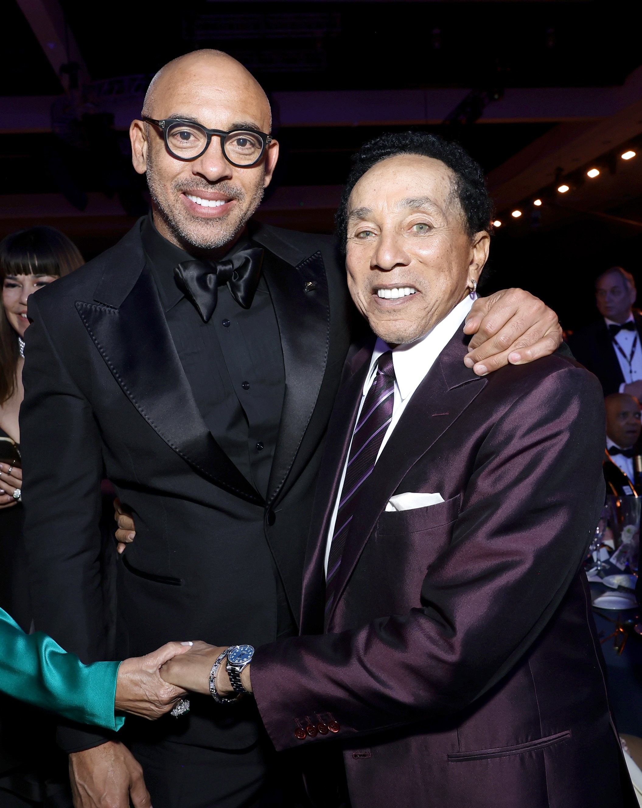  LOS ANGELES, CALIFORNIA - FEBRUARY 03: (L-R) CEO of the Recording Academy and MusiCares Harvey Mason jr. and honoree Smokey Robinson attend MusiCares Persons of the Year Honoring Berry Gordy and Smokey Robinson at Los Angeles Convention Center on Fe