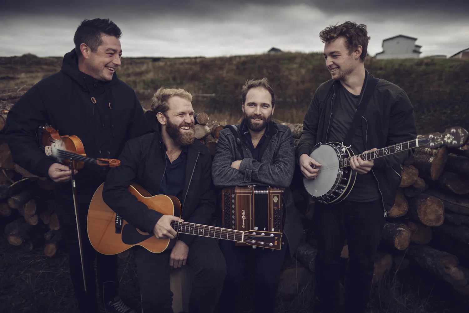 the 4 members of Rum Raggged with their instruments