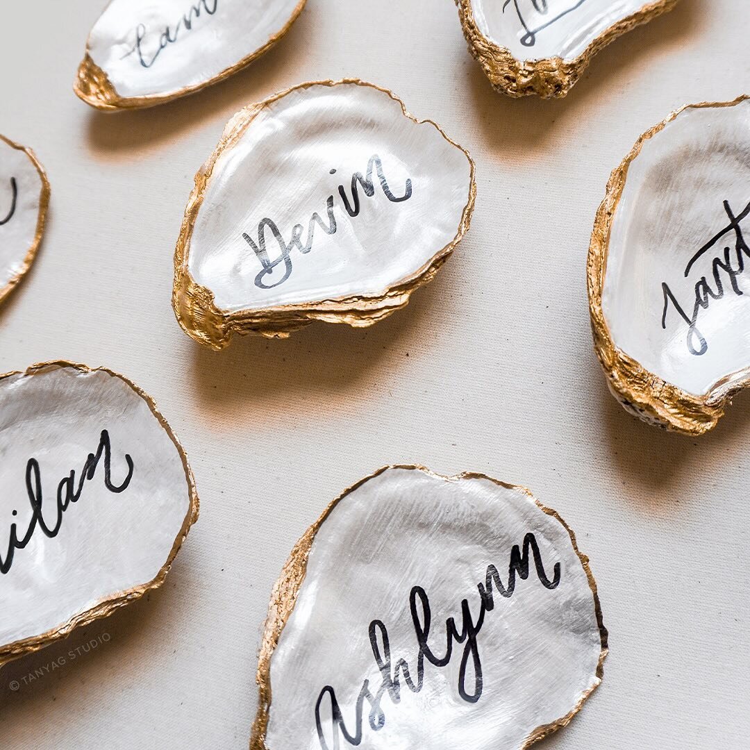 On the desk today are these gorgeous personalized oyster shells that will be used as place cards AND as keepsake gifts. We&rsquo;re in love with the idea that these will remind guests of attending a momentous event and be able to keep the shells as a