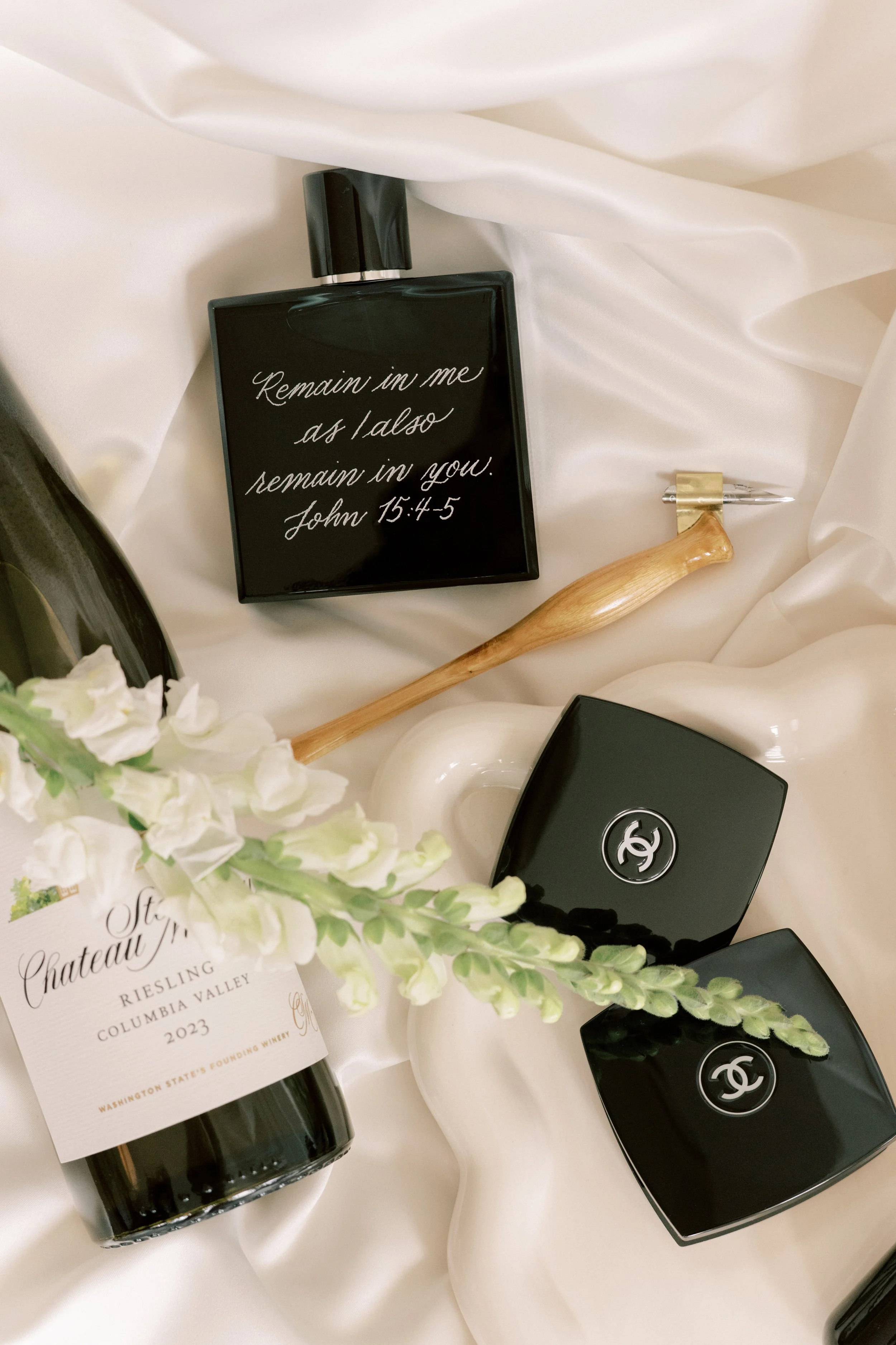 Image contains a custom engraved cologne bottle as a wedding gift by Tanyag Studio. Photography done by Morgan Renee Photography.