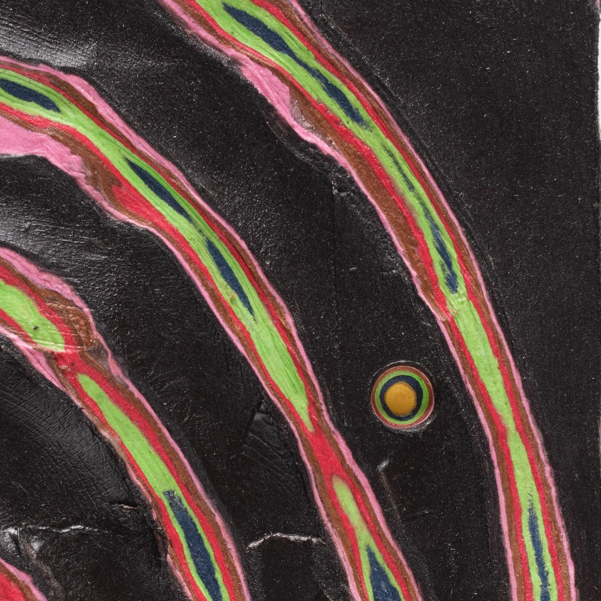 Macro detail of Black #5 highlighting carved paper relief and internal structure