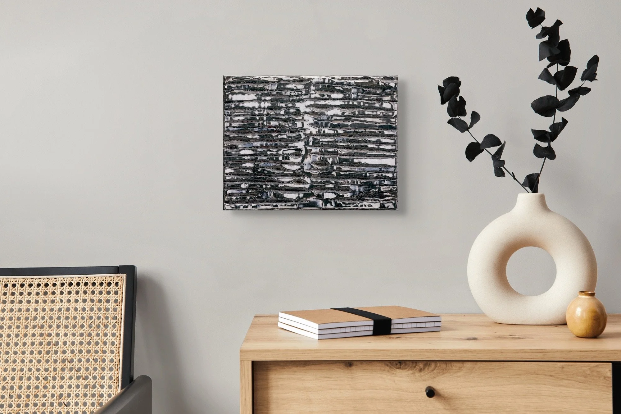 Axial Memory, sculptural paper artwork by Michele Bonds, displayed in neutral interior setting