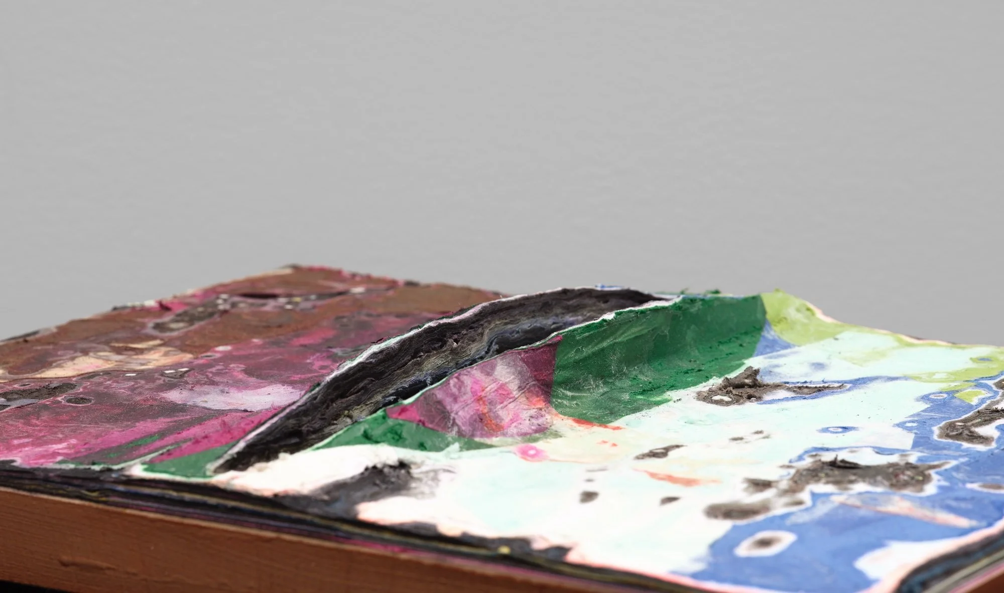 Surface detail of Spring Chaos with exposed layers and sculptural cuts