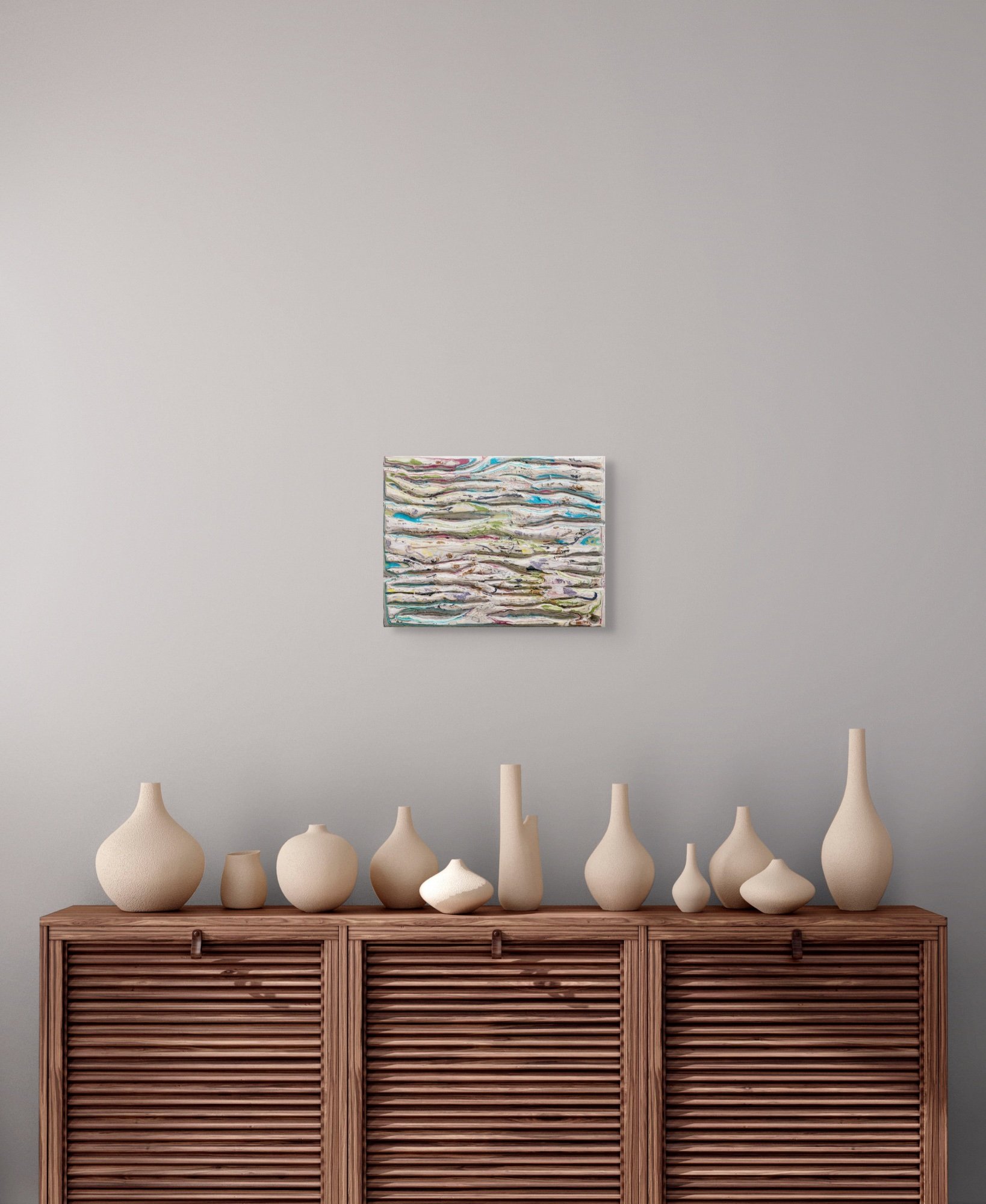 Accretion of Becoming, layered and hand-carved paper artwork by Michele Bonds, shown in contemporary interior