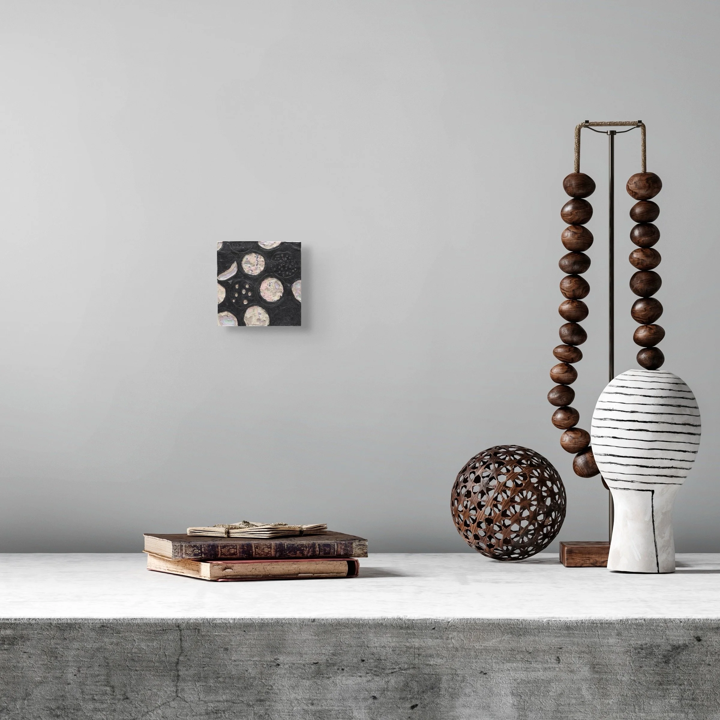 Black #6, layered and hand-carved paper artwork by Michele Bonds, shown in contemporary interior