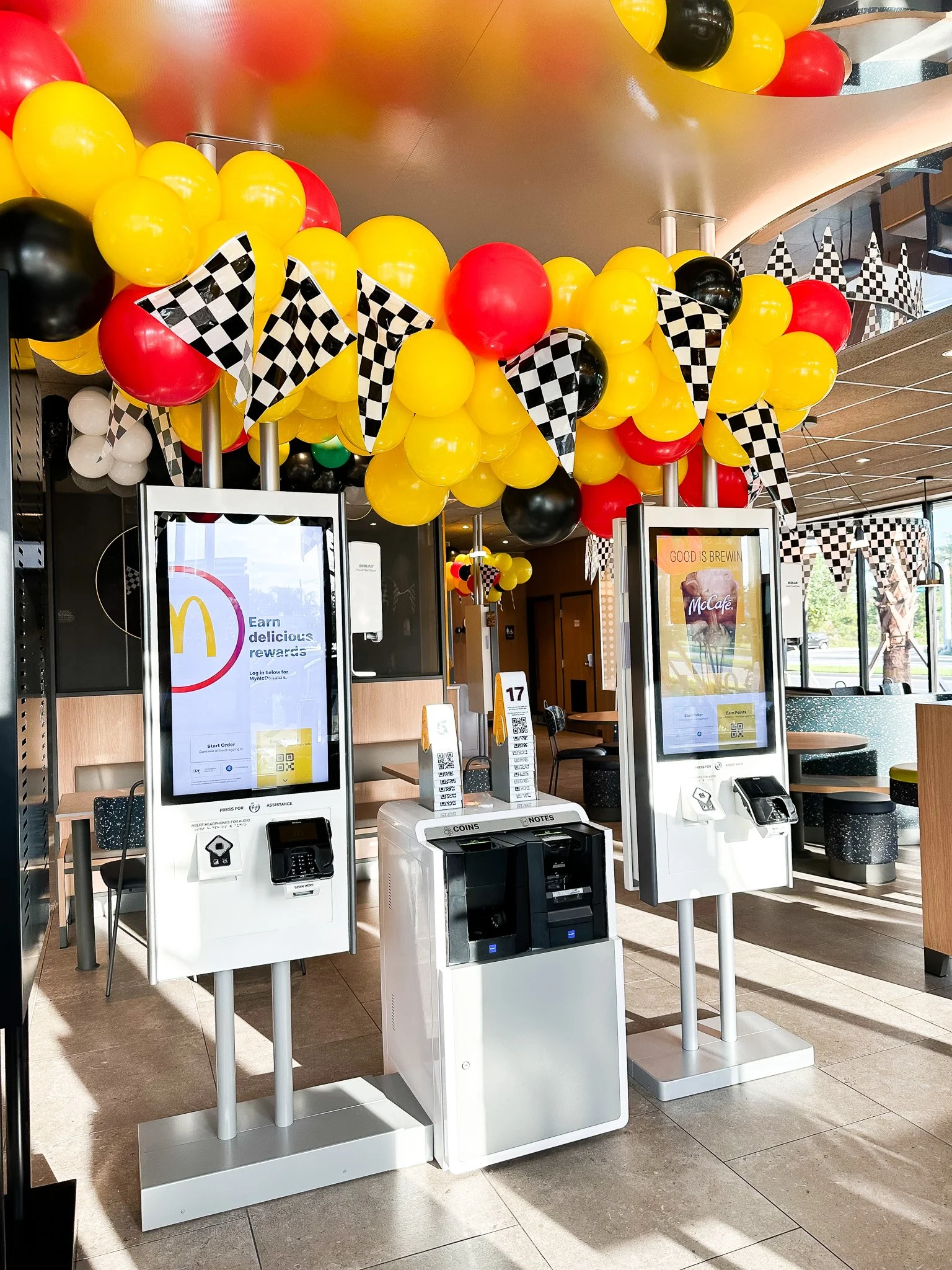 Mcdonalds corporate ribbon cutting with organic balloon garland.