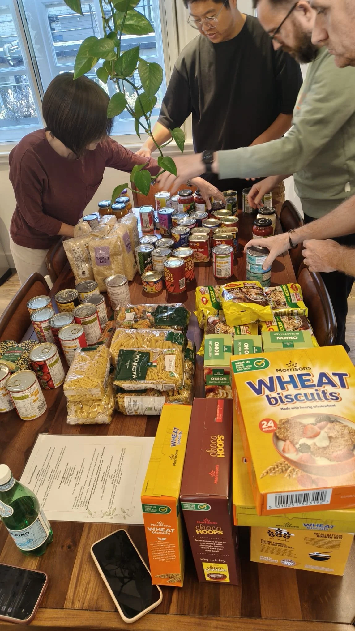  Foodbank Grand Prix. 
Participants work in teams to design and build sections of a race track using donatable food items, cardboard, and recyclable materials. The challenge culminates with teams navigating a remote-controlled car around the complete