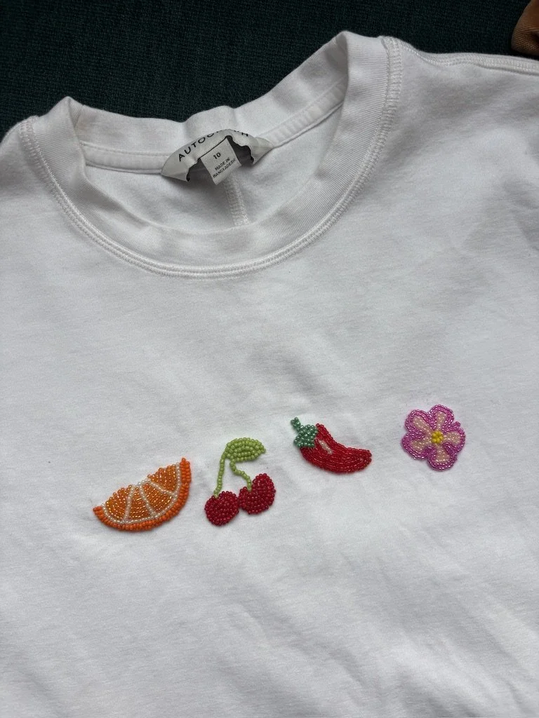  Creative Upcycling Workshop. 
Our Upcycling Workshop Collection gives guests the opportunity to transform existing garments and accessories into something uniquely their own. Choose from faux screen printing, beaded embroidery and fabric patches. 
 