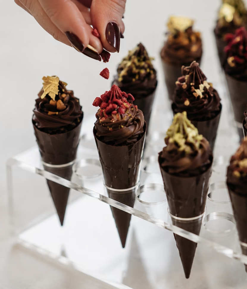  Gelato Delights Experience. 
Guests create their own miniature chocolate "gelato" cones, experimenting with colourful coatings, delicious fillings and irresistible toppings before finishing with a miniature affaux-gato shot.
 £60pp. 
 
Browse by: Fe